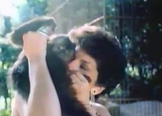 Curly-haired MILF straight-up blows a monkey